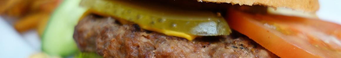 Eating American (Traditional) Burger at Muddbones Tx restaurant in Bonham, TX.